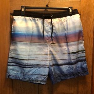 B.SPLIT SWIM TRUNKS